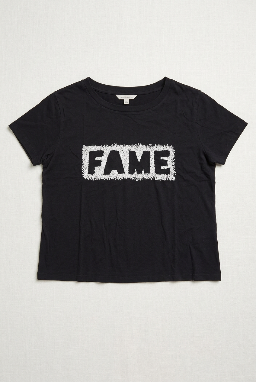 AI-generated front flat lay of French Connection black women's Large FAME tee with textured white embroidered surround. See original photos for exact stitching, tags and possible handling marks.