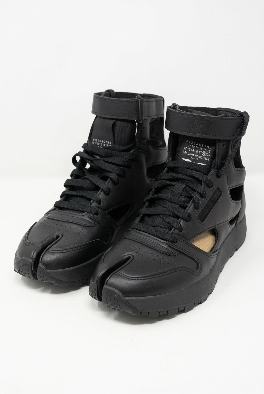 AI-enhanced front three-quarter view of black Maison Margiela x Reebok Classic Leather Tabi High trainers, UK 6.5 / EU 40.