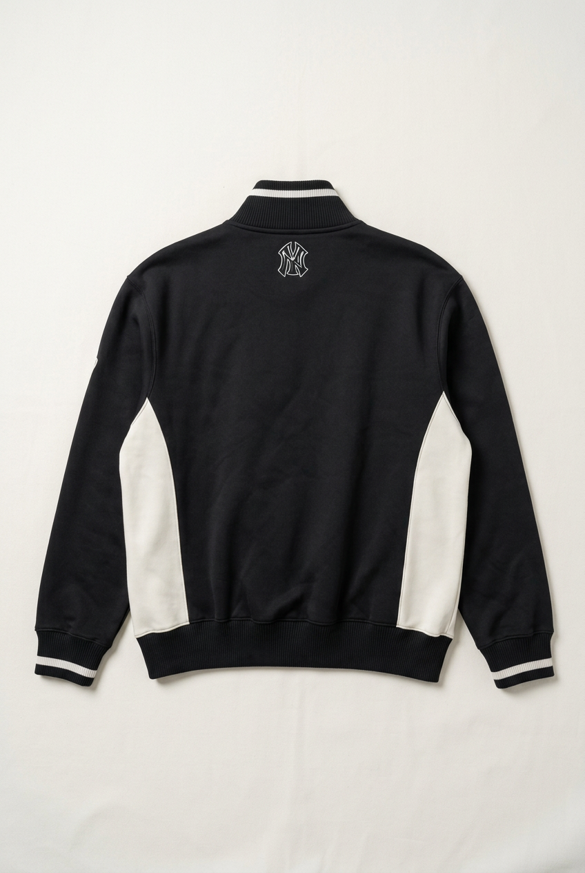 AI-generated back flat lay of Large New York Yankees track jacket with upper-back NY monogram and off-white side panels. Refer to original garment photographs for exact details.