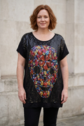 AI-generated photographic lifestyle illustration of Butler & Wilson sequin skull tunic on an XXL-proportioned woman. Fit is illustrative; trousers not included. See original photos for actual detailing and condition.