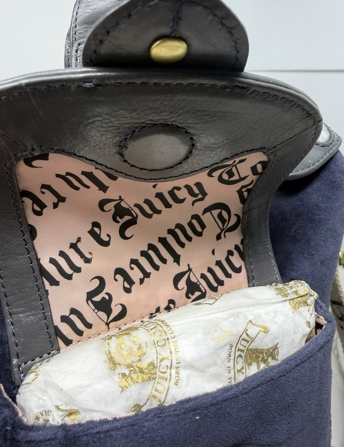 Large navy velour shoulder bag by Juicy Couture with grey leather trim and matching shoulder strap, featuring a spacious design.