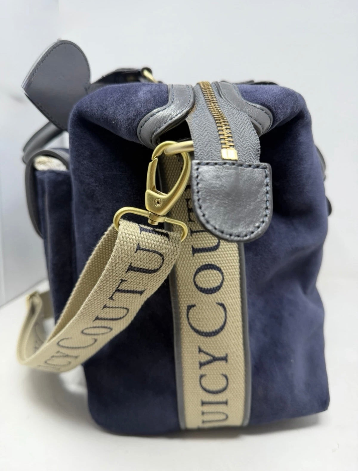 Juicy Couture large navy velour shoulder bag with grey leather trim and shoulder strap, stylish and spacious for everyday use.