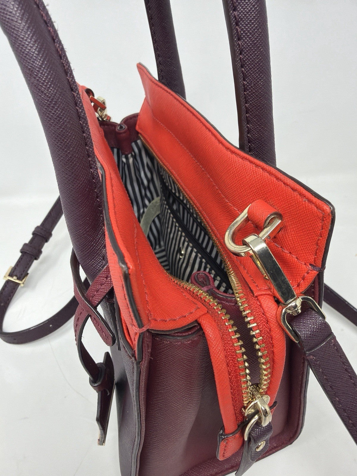 Kate Spade New York Small Cameron Saffiano leather satchel in burgundy and red with gold-tone hardware and top handle.