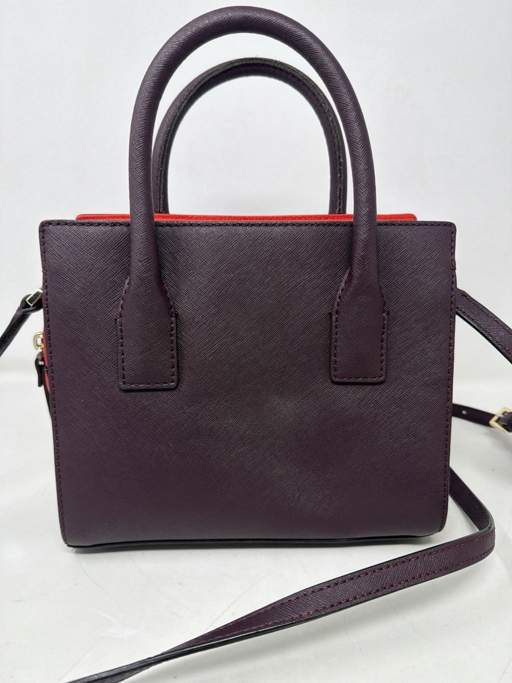 Kate Spade New York Small Cameron Saffiano leather satchel in burgundy and red, featuring a structured design with top handles.