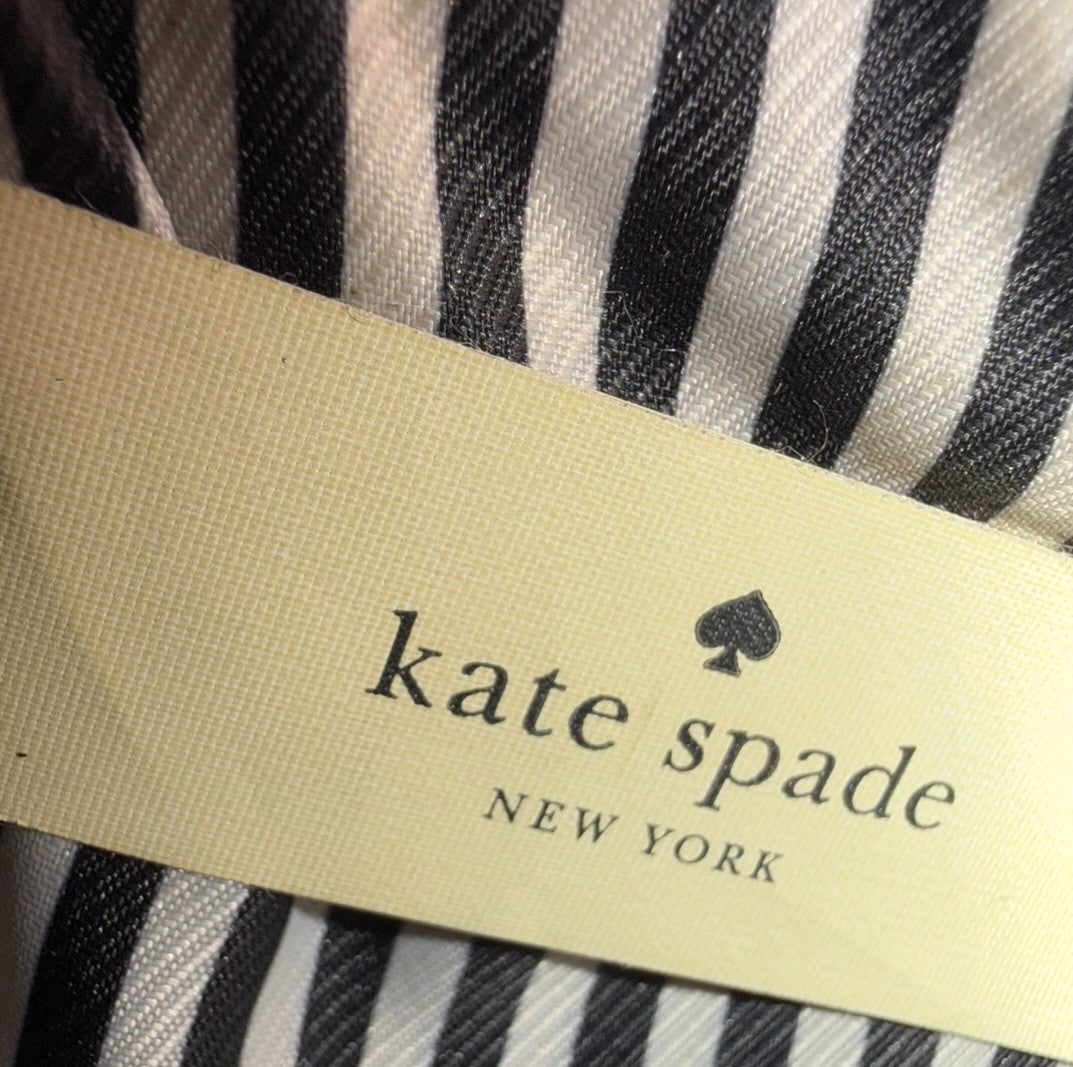 Kate Spade New York Small Cameron leather satchel in burgundy and red with gold hardware, showing the structured bag and top handles.