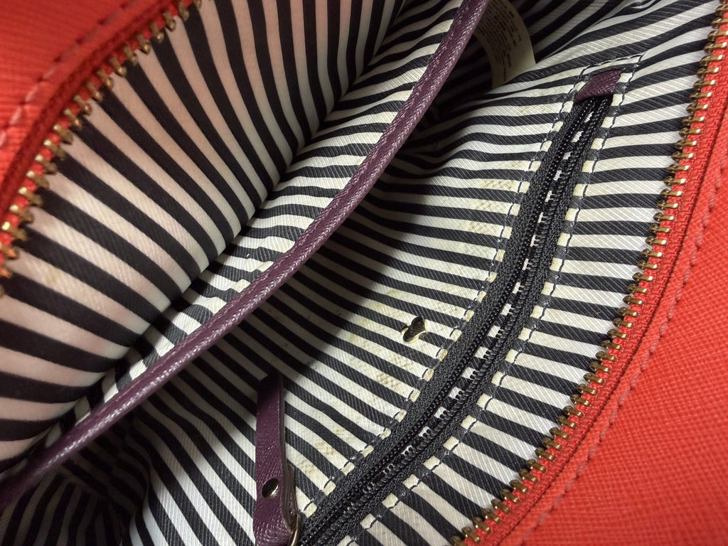 Kate Spade New York Small Cameron leather satchel in burgundy and red, featuring saffiano textured leather and gold-tone hardware.