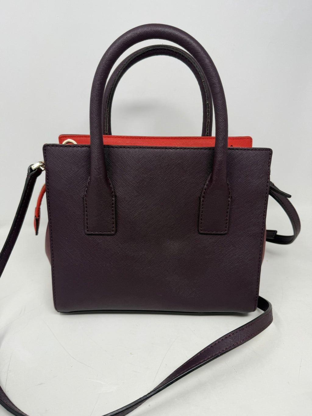 Kate Spade New York Small Cameron Saffiano Leather Satchel in burgundy and red, with gold-tone hardware and top handles.