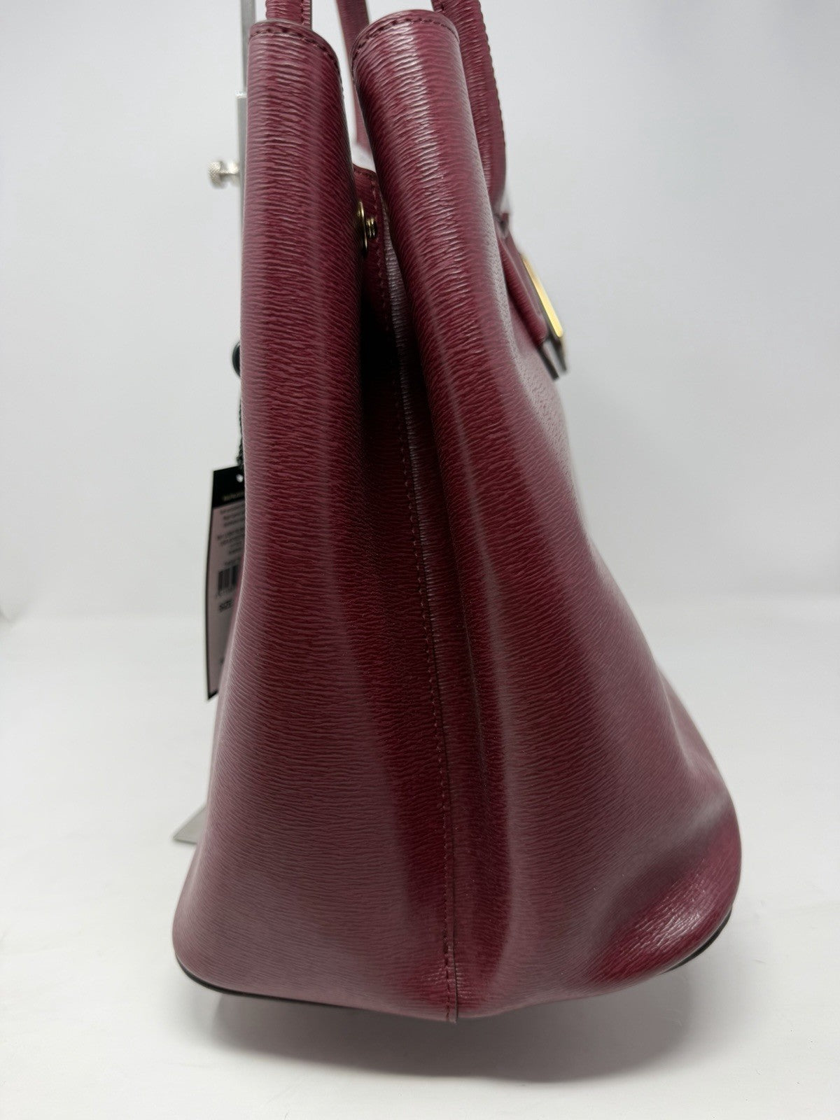 Side view of the Lauren Ralph Lauren City Tote in rosewood leather