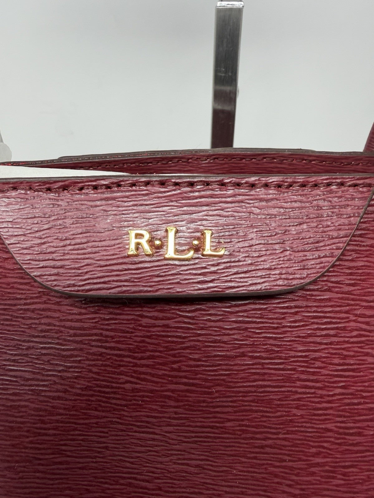 Gold-tone R·L·L logo on the rosewood leather City Tote