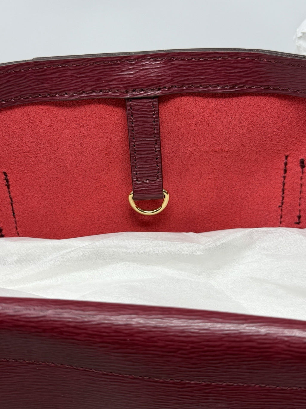 Interior clip and red lining of the rosewood City Tote