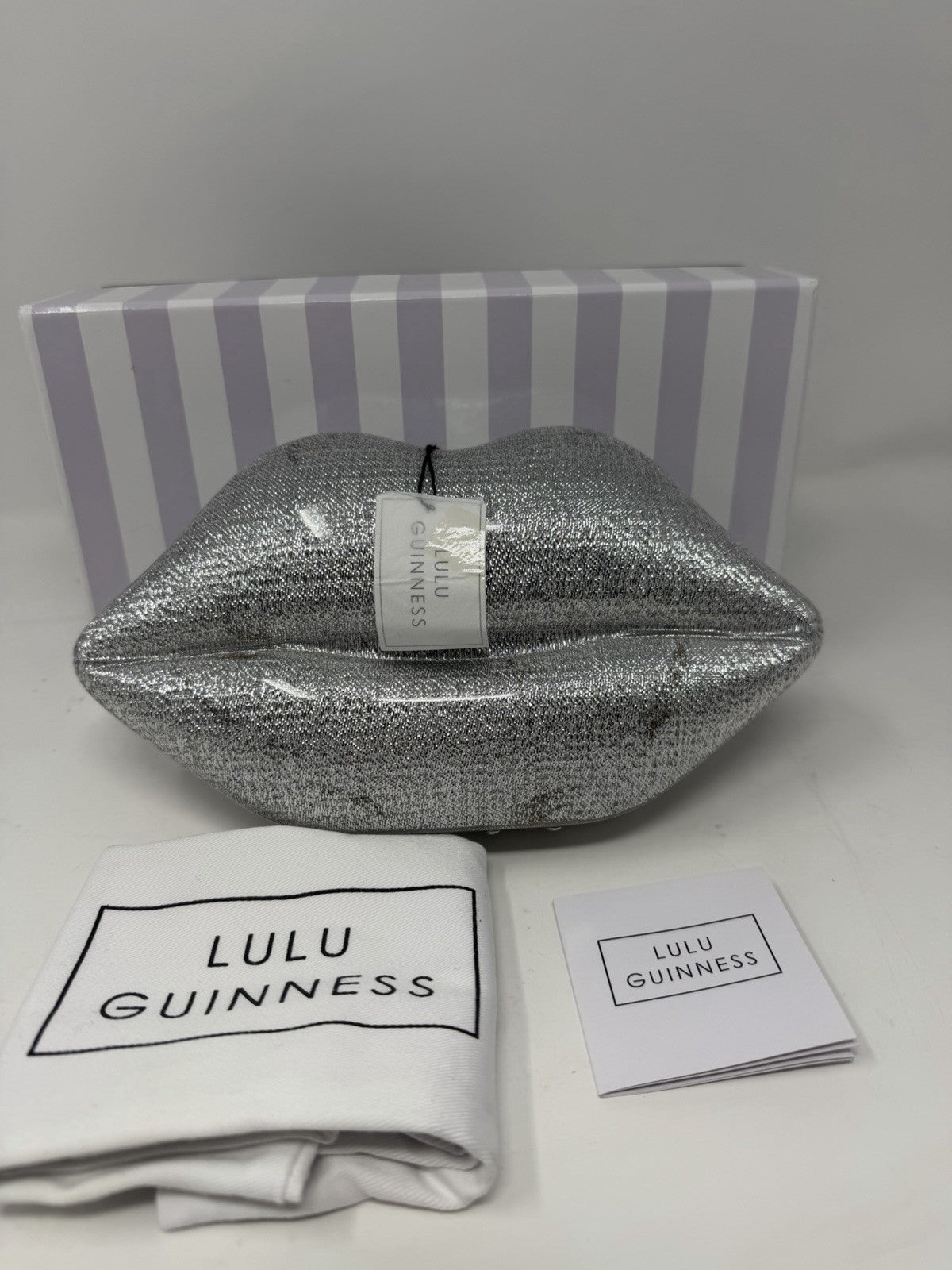 Lulu Guinness silver Perspex Lip Clutch, with its striped box, dust bag and booklet
