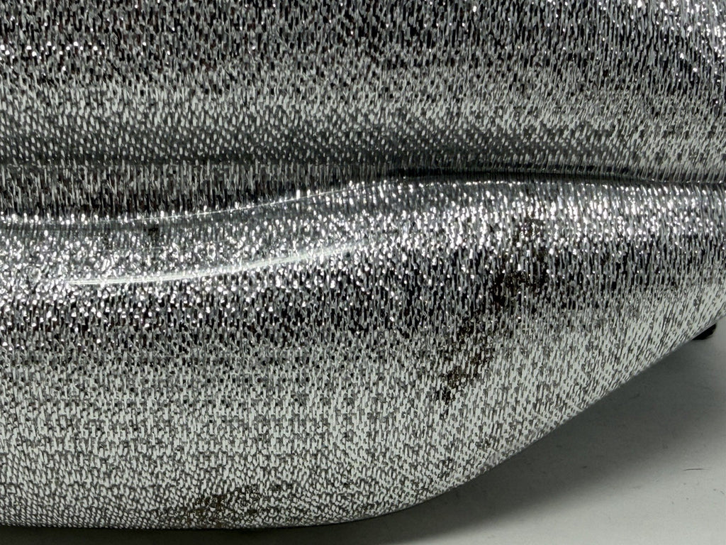 Lulu Guinness silver Perspex Lip Clutch, close-up of tarnish within the mirrored finish