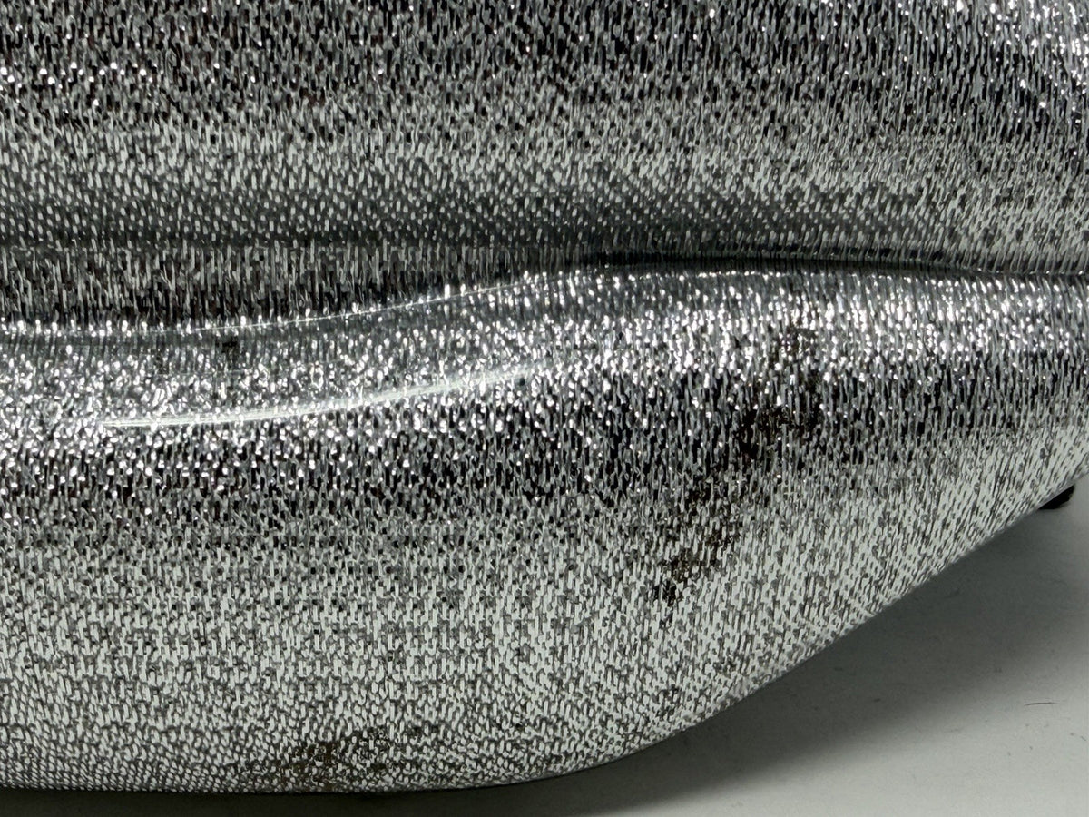 Lulu Guinness silver Perspex Lip Clutch, close-up of tarnish within the mirrored finish