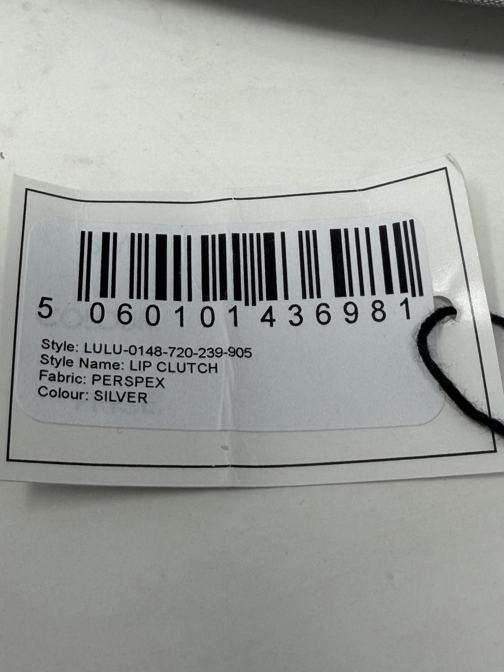 Lulu Guinness silver Perspex Lip Clutch, tag with style code and barcode