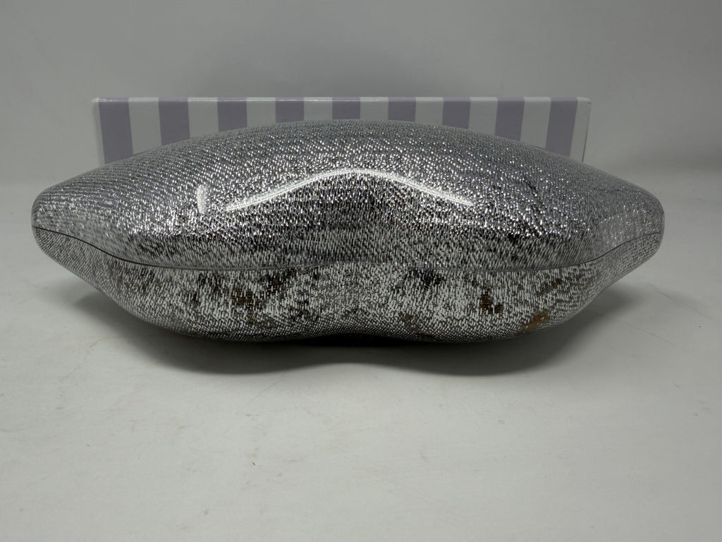 Lulu Guinness silver Perspex Lip Clutch, top view showing discolouration