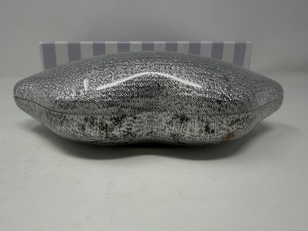 Lulu Guinness silver Perspex Lip Clutch, top view showing discolouration