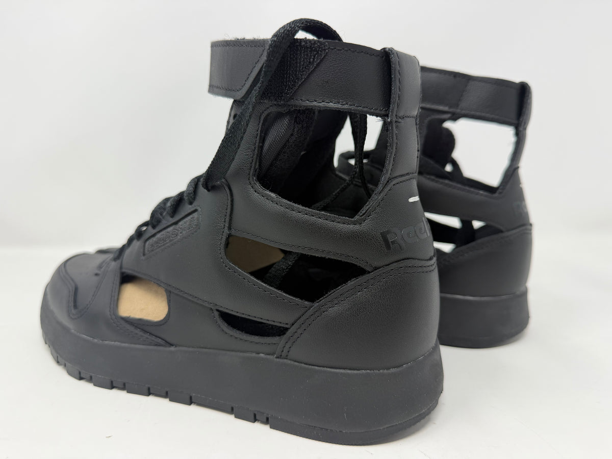 Maison Margiela × Reebok Classic Leather Tabi High black trainers, UK 6.5, with distinctive split-toe design and sleek leather finish.