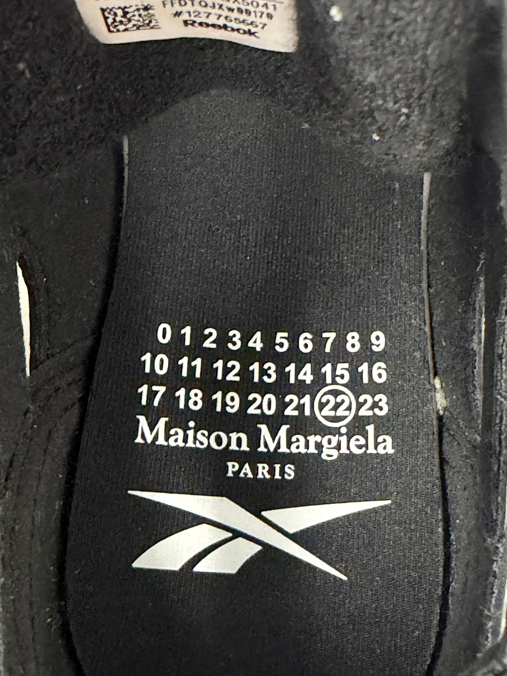 Maison Margiela × Reebok Tabi insole showing the Maison Margiela Paris and Reebok logos