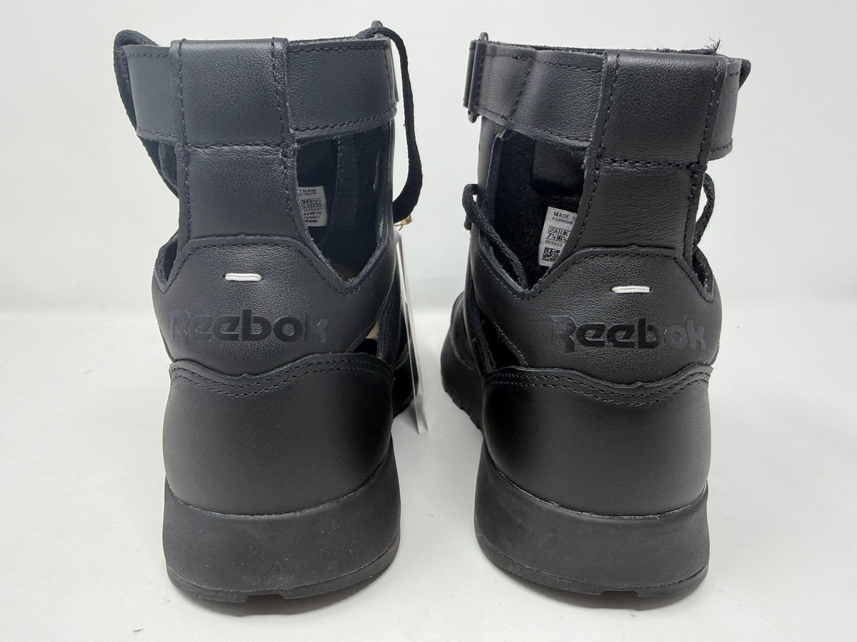 Maison Margiela × Reebok Classic Leather Tabi High Black trainers, UK 6.5, featuring unique split-toe design and sleek leather finish.