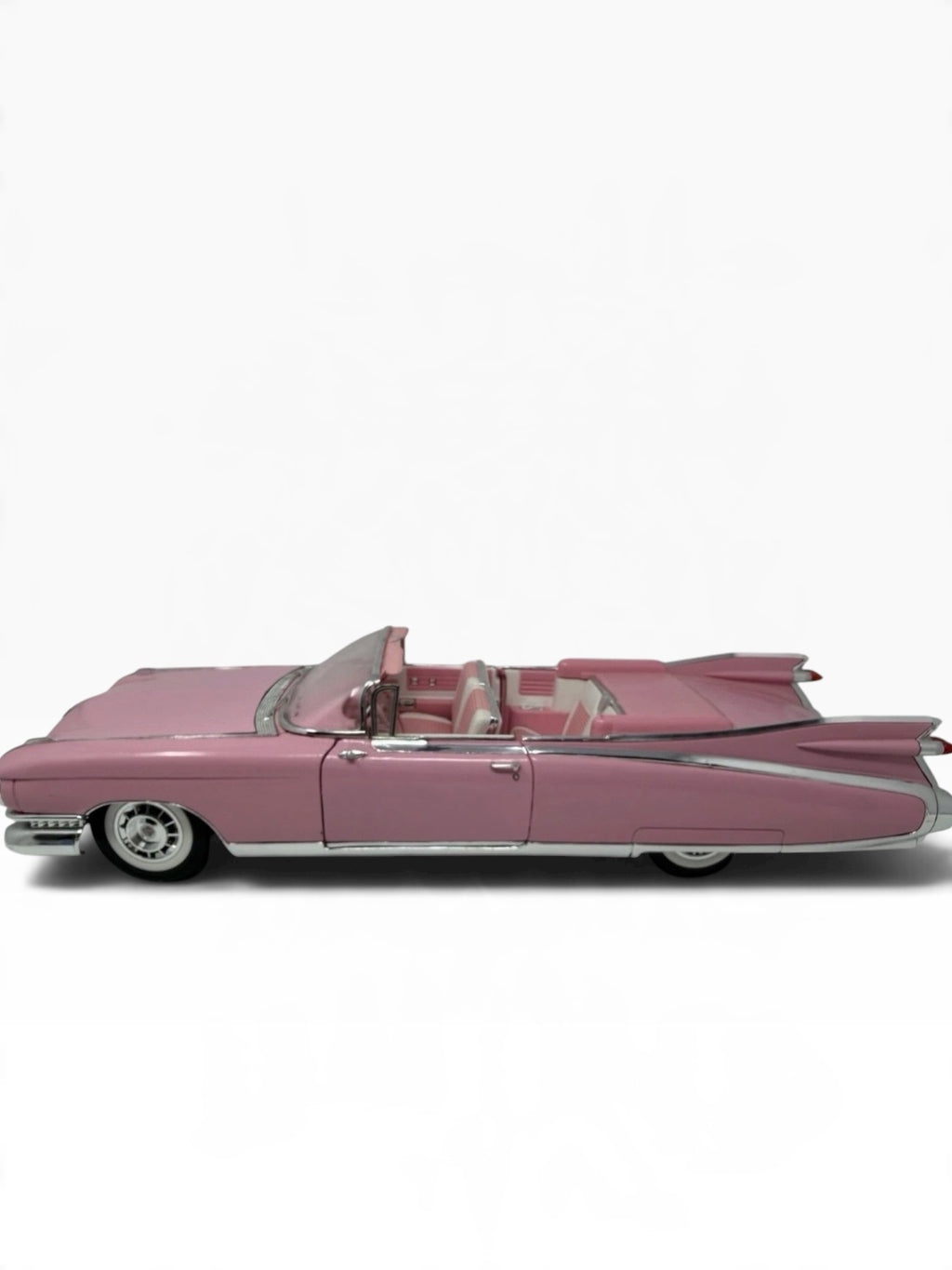 Pink Maisto 1959 Cadillac Eldorado Biarritz diecast convertible model, detailed collectible toy in 1:12 scale.