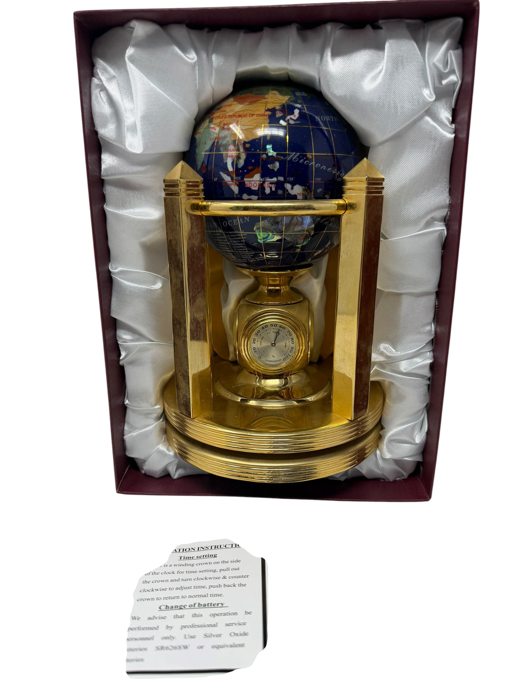 Meridian Collection gemstone world globe with clock, thermometer, and hygrometer, featuring vibrant globe design and decorative stand.