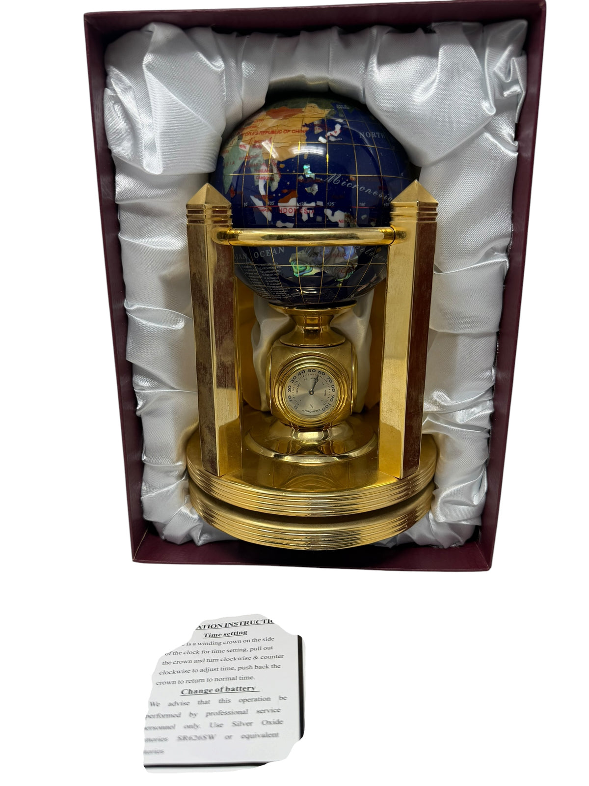 Meridian Collection gemstone world globe with clock, thermometer, and hygrometer, featuring vibrant globe design and decorative stand.