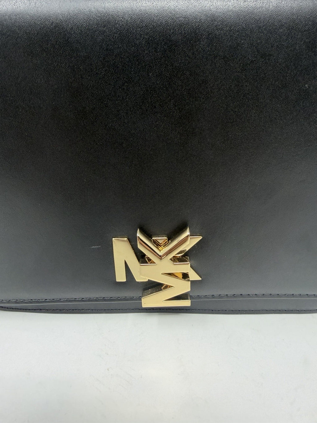 Michael Kors Mott large chain shoulder bag in black leather, MK logo close-up