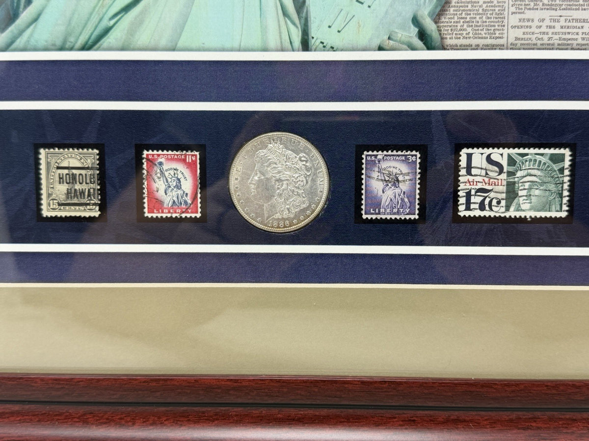 New York Times Statue of Liberty framed display, mounted stamps and 1886 Morgan silver dollar