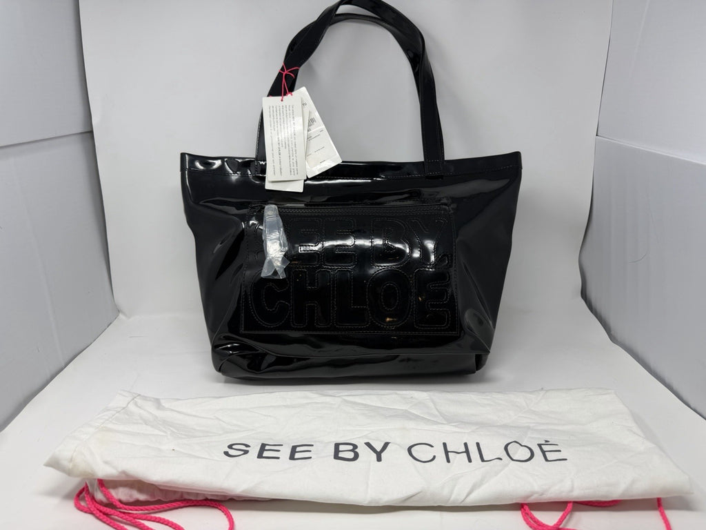 See By Chloé large black patent logo tote shopper with spacious interior, handles, dust bag, and included card.