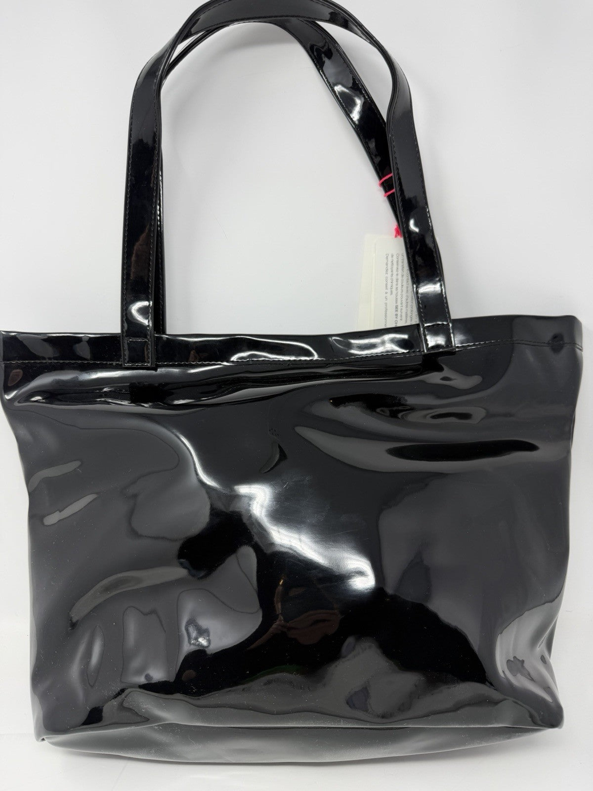 See By Chloé large black patent logo tote shopper with double handles, visible logo detail, dust bag, and included card.