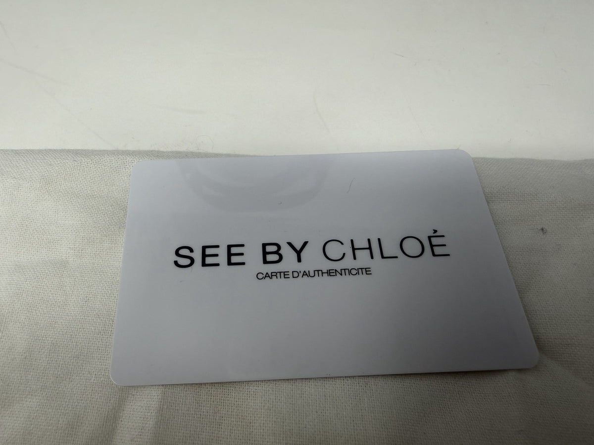 See By Chloé large black patent logo tote shopper with dust bag and card, showcasing spacious interior and stylish design.