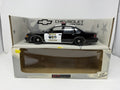 UT Models 1:18 Chevrolet Caprice Brea Police die-cast model displayed on its box base with the window box below