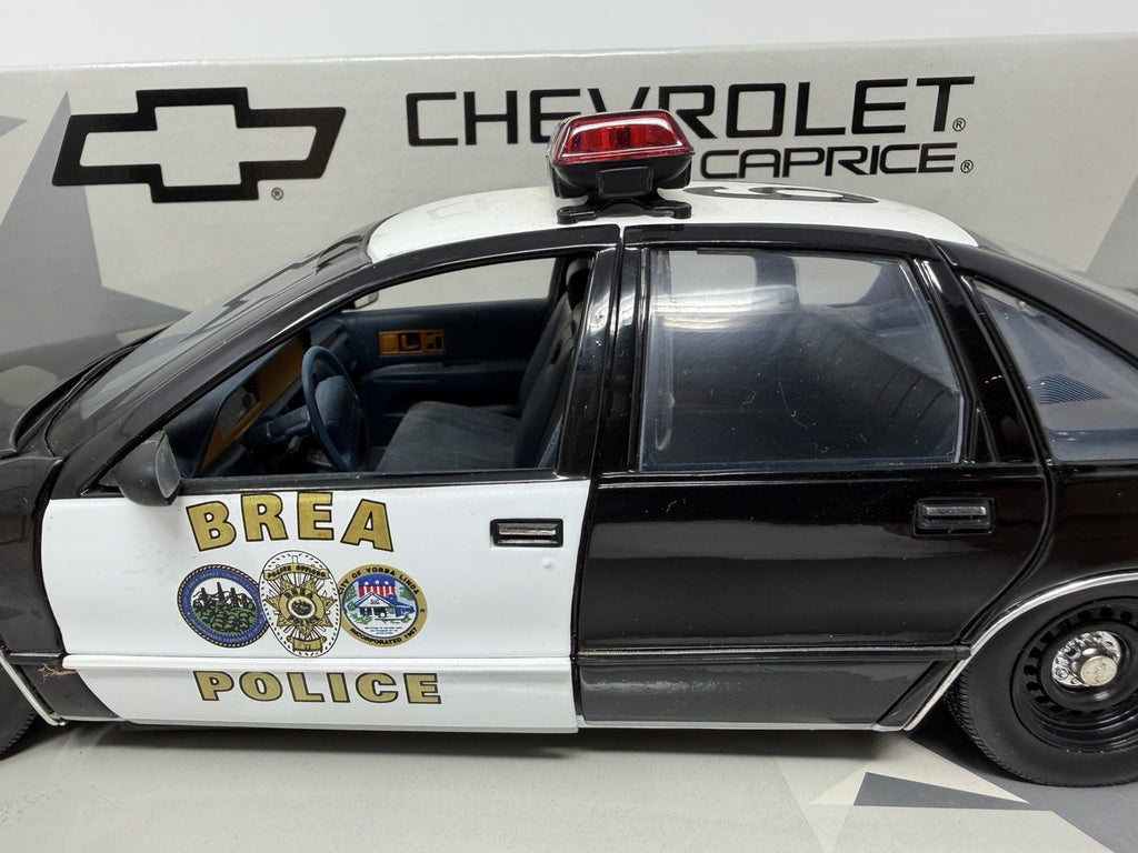 UT Models 1:18 Chevrolet Caprice Brea Police, driver's side with Brea Police livery and roof light bar