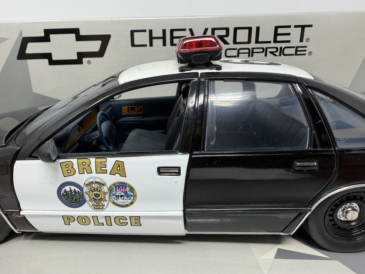 UT Models 1:18 Chevrolet Caprice Brea Police, driver's side with Brea Police livery and roof light bar