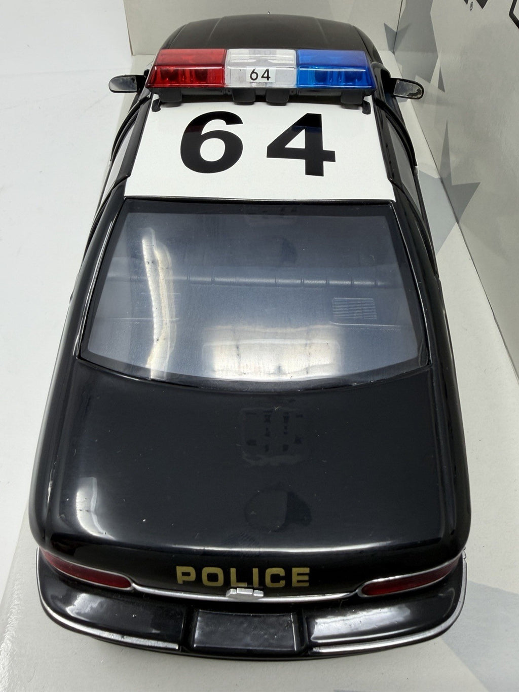 UT Models 1:18 Chevrolet Caprice Brea Police, rear overhead view with roof number 64 and POLICE on the boot