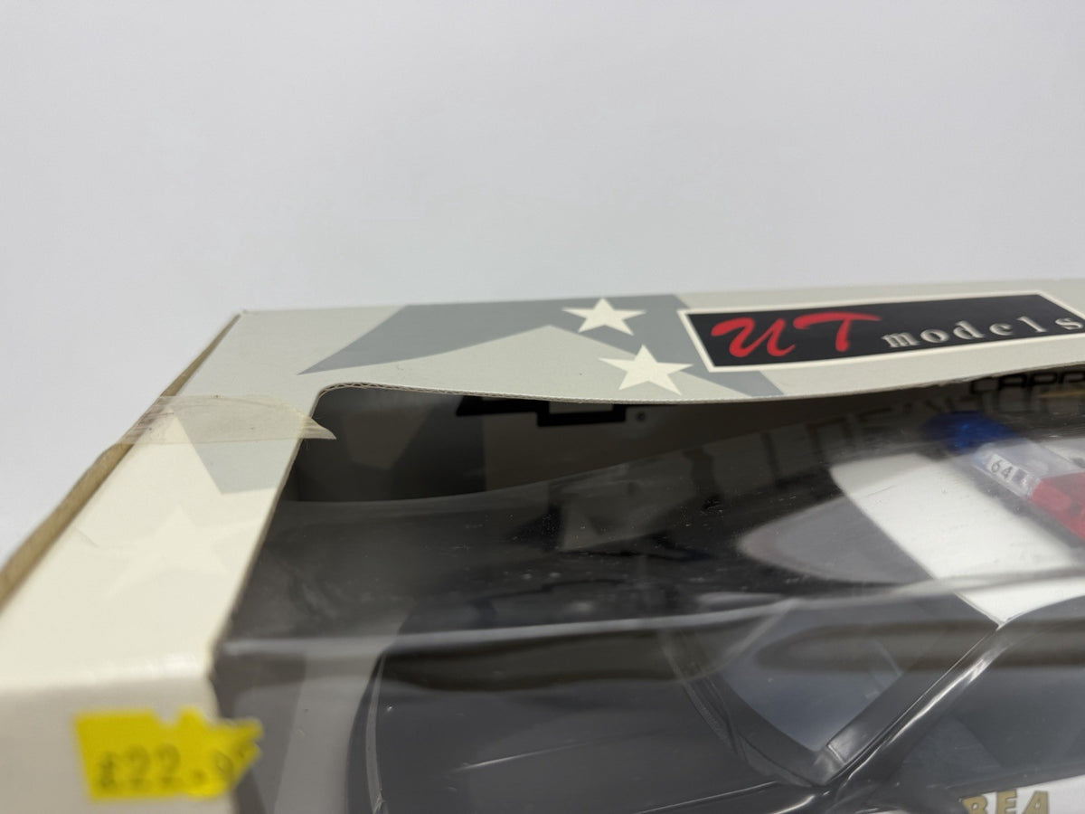 UT Models 1:18 Chevrolet Caprice Brea Police box window front with an old price sticker